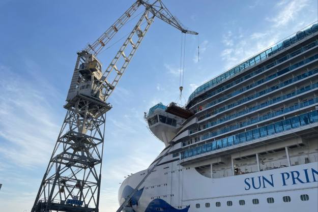 View of a cruise liner and a crane in the Fincantieri shipyard in Monfalcone