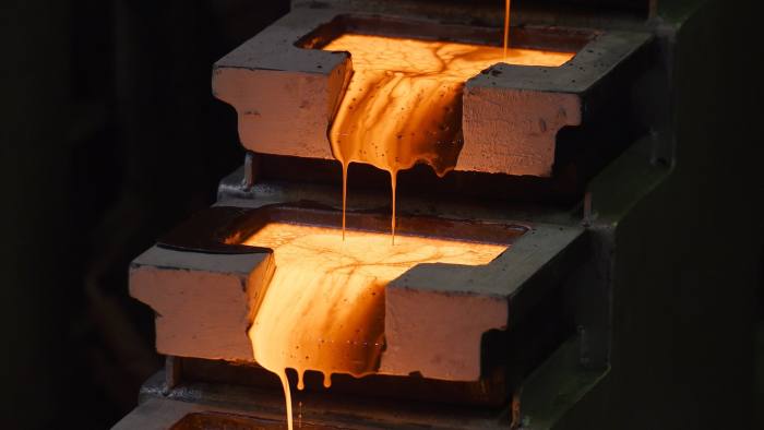 Molten gold is poured into molds at the Norton Gold Fields Ltd. Paddington operations 35 kilometers north-west of Kalgoorlie, Australia, on Tuesday, Aug. 4, 2015. Norton Gold Fields is controlled by China's Zijin Mining Group, the world's biggest gold producer by market value. Photographer: Carla Gottgens/Bloomberg
