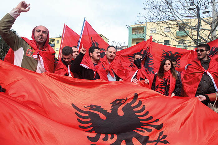 Members of the Albanian Cham community shoot slogans as they protest against Albania-Greece talks, in front of Greek Embassy in Tirana, Albania, February 24, 2018. REUTERS/Florion Goga - RC1D2AF598D0