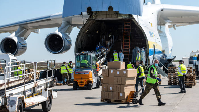 SCHKEUDITZ, GERMANY - APRIL 27: Soldiers of the Bundeswehr, the German armed forces, unload a shipment of 10 million protective face masks and other protective medical gear that had arrived on an Antonov 225 cargo plane from China at Leipzig/Halle Airport during the novel coronavirus crisis on April 27, 2020 in Schkeuditz, Germany. The flight, coordinated by the Bundeswehr, the German armed forces, is one of three that will bring 25 million masks to Germany. Germany currently has approximately 157,000 confirmed cases of Covid-19 infection, of which approximately 103,000 have recovered and 6,0000 have died. (Photo by Jens Schlueter/Getty Images)