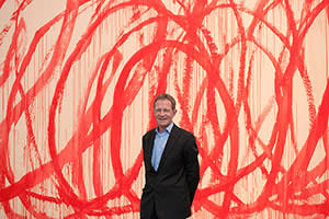 Nicholas Serota in front of a Cy Twombly painting at Tate Modern