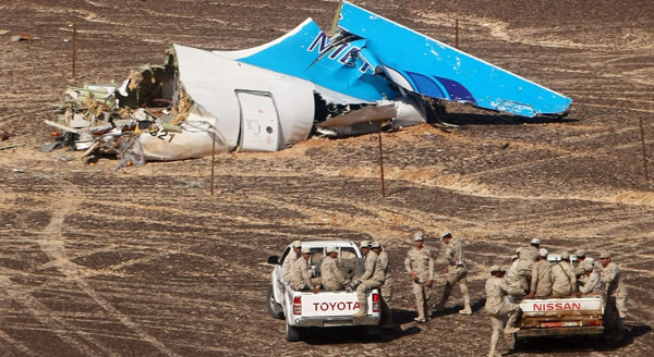 Russian plane crashes in Egypt with 224 aboard...epa05007509 A handout picture provided by the Russian Emergency Ministry press service on 02 November 2015 shows Egyptian servicemen approaching a piece of wreckage of Russian MetroJet Airbus A321 at the site of the crash in Sinai, Egypt, 01 November 2015. The A321 plane of Metrojet en route from Sharm-el-Sheikh, to St. Petersburg crashed in the Sinai, Egypt on 31 October 2015, killing all 224 people on board. EPA/MAXIM GRIGORIEV / RUSSIAN EMERGENCY MINISTRY / HANDOUT HANDOUT EDITORIAL USE ONLY/NO SALES
