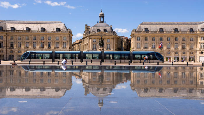 A tram passing the Miroir d’Eau on Place de la Bourse in Bordeaux (Photograph: Corbis)