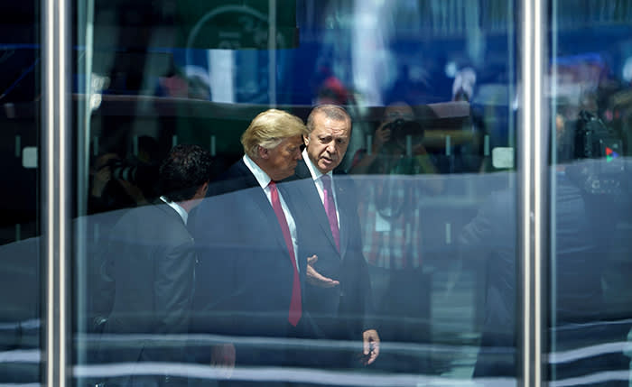 TOPSHOT - US President Donald Trump (L) and Turkey's President Recep Tayyip Erdogan (R) speak as they attend the NATO (North Atlantic Treaty Organization) summit at the NATO headquarters in Brussels on July 11, 2018. / AFP PHOTO / Brendan SmialowskiBRENDAN SMIALOWSKI/AFP/Getty Images