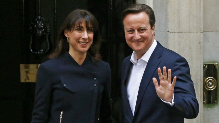 Britain's Prime Minister David Cameron waves as he arrives with his wife Samantha at Number 10 Downing Street in London...Britain's Prime Minister David Cameron waves as he arrives with his wife Samantha at Number 10 Downing Street in London, Britain May 8, 2015. Cameron's Conservatives are set to govern Britain for another five years after an unexpectedly strong showing, but may have to grapple with renewed calls for Scottish independence after nationalists surged. REUTERS/Phil Noble TPX IMAGES OF THE DAY