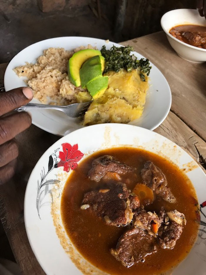Staple diet: the beef stew 'nyama' with some 'matoke', rice, avocado and 'dodo' greens on the side