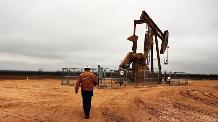 An oil well owned an operated by Apache Corporation in the Permian Basin are viewed on February 5, 2015 in Garden City, Texas