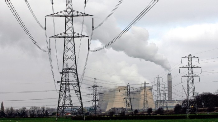 Electricity pylons stand beside cooling towers at E.ON's coal-fired power station in Ratcliffe-on-Soar, U.K., on Wednesday, March 2, 2011. PPL Corp., owner of Pennsylvania's second-largest utility, agreed to buy E.ON AG's power grid in central England for 3.5 billion pounds ($5.6 billion) in cash to triple its customers in the U.K. Photographer: Paul Thomas/Bloomberg