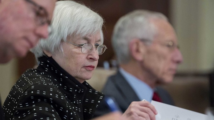 Janet Yellen and Stanley Fischer attend a meeting of the Board of Governors of the Federal Reserve in Washington, DC