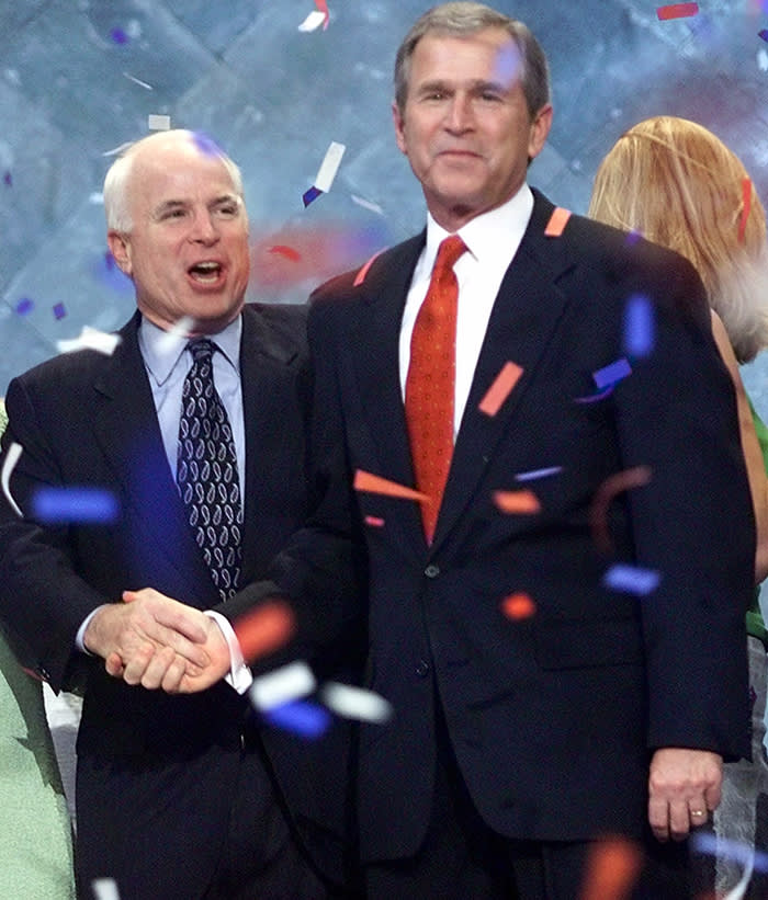 Senator John McCain shakes hands with Republican Presidential candidate George W. Bush at the conclusion of the Republican National Convention in Philadelphia, Thursday, Aug. 3, 2000. (AP Photo/J. Scott Applewhite)
