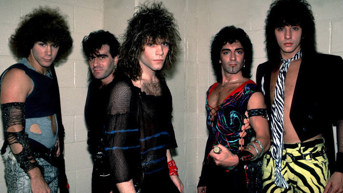 Portrait of American rock band Bon Jovi backstage before a performance at the Rosemont Horizon, Rosemont, Illinois, May 20, 1984. Pictured are, from left, David Bryan, Tico Torres, Jon Bon Jovi, Alec John Such, and Richie Sambora. (Photo by Paul Natkin/Getty Images)