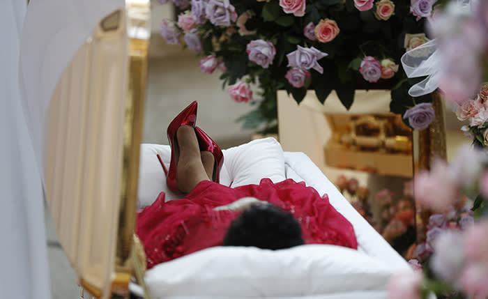 Aretha Franklin lies in her casket at Charles H. Wright Museum of African American History during a public visitation in Detroit, Tuesday, Aug. 28, 2018. Franklin died Aug. 16, 2018 of pancreatic cancer at the age of 76. (AP Photo/Paul Sancya, Pool)