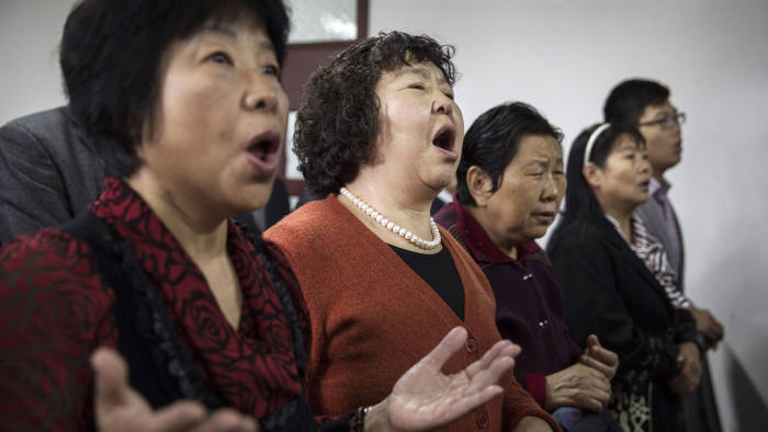 BEIJING, CHINA - OCTOBER 12:(CHINA OUT):Chinese Christians sing during a prayer service at an underground independent Protestant Church on October 12, 2014 in Beijing, China. China, an officially atheist country, places a number of restrictions on Christians and allows legal practice of the faith only at state-approved churches.?The policy has driven an increasing number of Christians and Christian converts 'underground' to secret congregations in private homes and other venues. While the size of the religious community is difficult to measure, studies estimate there more than 65 million Christians inside China with studies supporting the possibility it could become the most Christian nation in the world within a decade.  (Photo by Kevin Frayer/Getty Images)