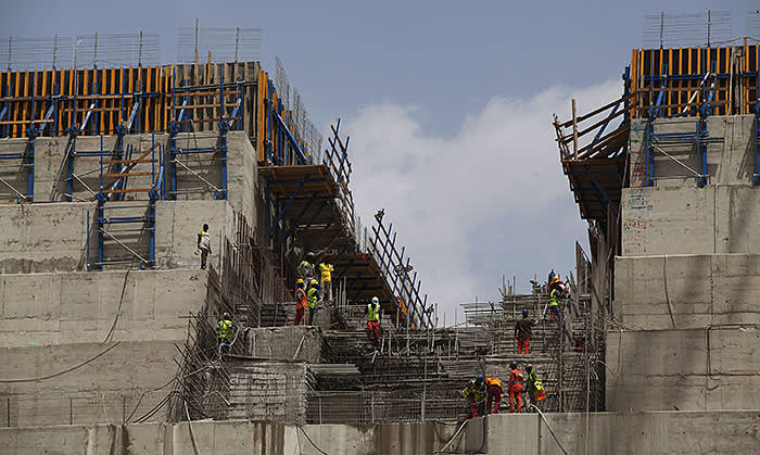 Ethiopian workers construct on March 31, 2015 the Grand Renaissance Dam near the Sudanese-Ethiopian border. Ethiopia began diverting the Blue Nile in May 2013 to build the 6,000 megawatt dam, which will be Africa's largest when completed in 2017. The leaders of Egypt and Ethiopia promised on March 24 to boost cooperation on the Nile river and turn a page on a long-running row over Addis Ababa's controversial dam project. Egypt, heavily reliant for millennia on the Nile for agriculture and drinking water, feared that the Grand Renaissance Dam would decrease its water supply. AFP PHOTO / ZACHARIAS ABUBEKER (Photo credit should read ZACHARIAS ABUBEKER/AFP/Getty Images)