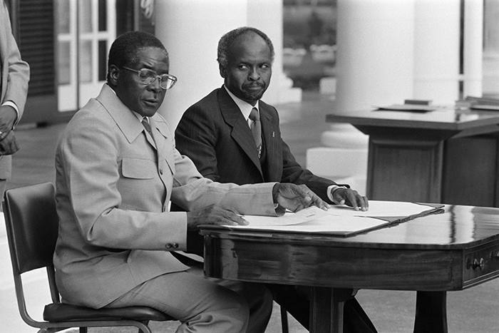 ZIMBABWE - APRIL 16: President Canaan Banana (right) and Prime Minister Robert Mugabe attend the ceremony for the independence of Zimbabwe in Salisbury, Zimbabwe on April 16, 1980. (Photo by Jean-Claude FRANCOLON/Gamma-Rapho via Getty Images)