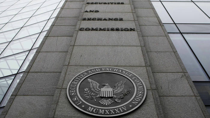 FILE- In this file photo made Dec. 17, 2008, shows the exterior of the Securities and Exchange Commission (SEC) headquarters in Washington. Federal regulators filed civil fraud charges against an investment adviser and his firm in connection with complex securities tied to mortgages during the housing market bust. (AP Photo/File)