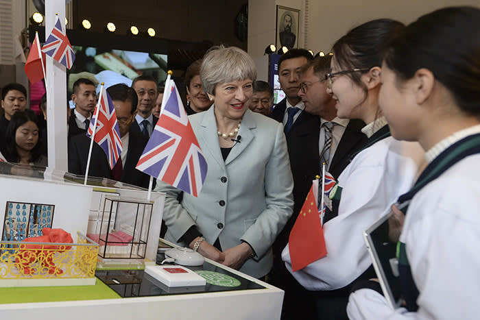 British Prime Minister Theresa May interacts with Chinese youth during a tour to the UK-China Spirit of Youth Festival in Wuhan in central China's Hubei province, Wednesday Jan. 31, 2018. (Chinatopix via AP)