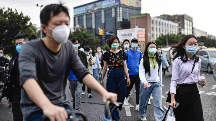 GUANGZHOU, CHINA - MARCH 26: Citizens return to work in Guangzhou, China on March 26, 2020. After two months of hard work, the new coronavirus was brought under control and cities in China began to resume operations. (Photo by Stringer/Anadolu Agency via Getty Images)