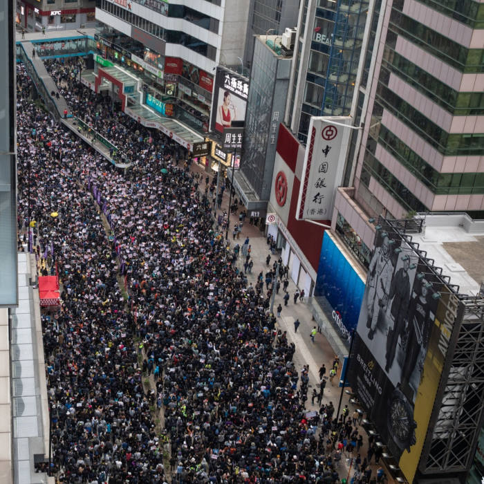 Demonstrators march toward central during a protest in the Causeway Bay district of Hong Kong, China, on Wednesday, Jan. 1, 2020. Hong Kong's turbulence shows no sign of abating in 2020, with the new year marked by rallies showing continued resistance against Beijing's tightening grip over the financial hub. Photographer: Kyle Lam/Bloomberg