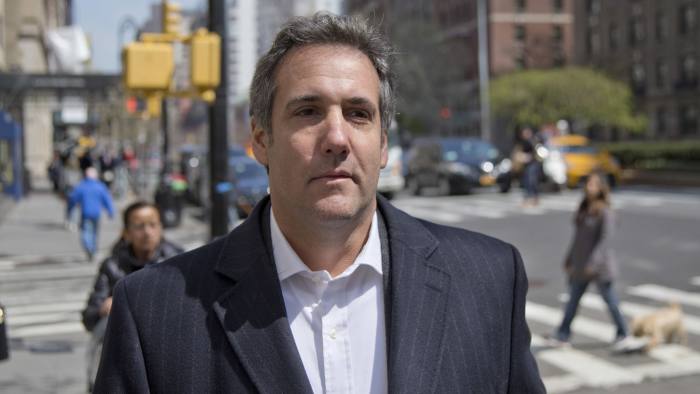 FILE - In this April 11, 2018, file photo, attorney Michael Cohen walks down the sidewalk in New York. Cohen, President Donald Trump's longtime personal lawyer who is under investigation by federal prosecutors in New York, said in his Twitter post Sunday, July 1, that he sat down for an interview with ABC News and his "silence is broken." (AP Photo/Seth Wenig, File)