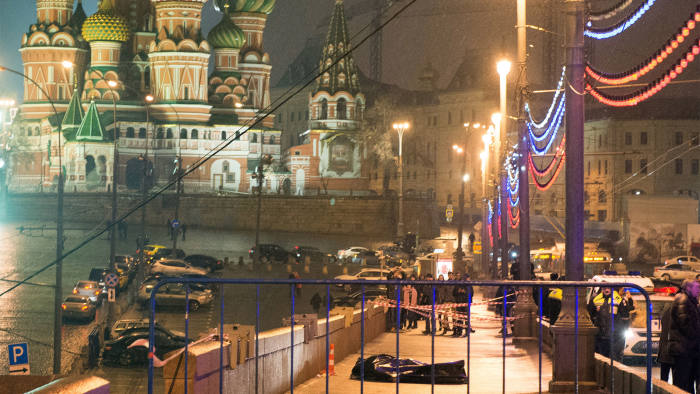 The covered body of Boris Nemtsov lies on Moskvoretsky bridge near St. Basil cathedral in central Moscow