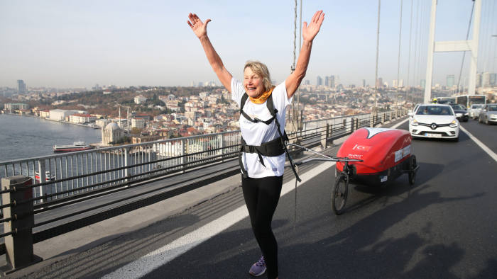 ISTANBUL, TURKEY - DECEMBER 20: 73-year-old British runner Rosie Swale Pope is seen continuing her journey as part of campaign for Nepal crossing Bosphorus-15 July Martyrs Bridge by foot, on December 20, 2019 in Istanbul, Turkey. British adventurer on Friday crossed Istanbuls iconic Bosphorus Bridge on foot as part of a 6,000-mile journey to support the people of Nepal. For her bridge run, she had to get special permission from Istanbuls Governorship, as the Bosphorus (15 July Martyrs) Bridge is not normally open for foot crossings. (Photo by Elif Ozturk/Anadolu Agency via Getty Images)