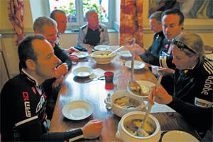 A group of cyclists shares lunch on day one