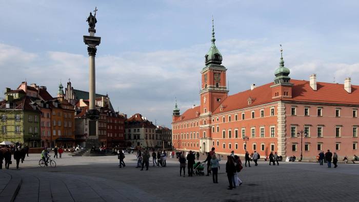 WARSAW, POLAND - APRIL 12:  People walk across Zamkowy Square by Krolewski Palace (R) and Zygumnt's Column at the entrance to the city's Old Town on April 12, 2010 in Warsaw, Poland. Warsaw is a popular tourist destination in eastern Europe.  (Photo by Sean Gallup/Getty Images)