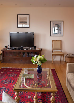 The main living area with Persian rug