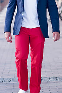 A man wearing red trousers