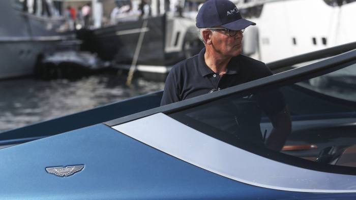 An Aston Martin decal sits on the hull of an Aston Martin AM37 luxury powerboat, built by Quintessence Yachts, during the Monaco Yacht Show (MYS) in Port Hercules, Monaco, on Thursday, Sept. 29, 2016. Over 125 of the world's most luxurious yachts will be displayed in Port Hercules during the 26th MYS which runs from Sept. 28 – Oct. 1. Photographer: Chris Ratcliffe/Bloomberg