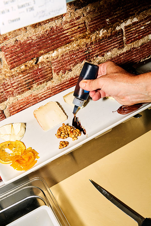 A cheese selection is prepared at Casellula, a cheese-focused wine bar in Manhattan’s Hell’s Kitchen area