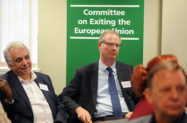Conservative MP Jeremy Lefroy, right, listens to Boston residents' concerns at the Brexit committee meeting on Thursday
