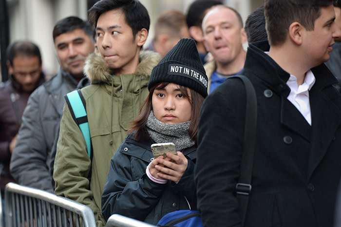 People queue outside Apple's Regent Street store in central London on November 3, 2017 waiting for the store to open on the say of the launch of the Apple iPhone X. Apple's flagship iPhone X hit stores on November 3, as the world's most valuable company predicted bumper sales despite the handset's eye-watering price tag and celebrated a surge in profits. The device features facial recognition, cordless charging and an edge-to-edge screen made of organic light-emitting diodes used in high-end televisions. It marks the 10th anniversary of the first iPhone release and is released in about 50 markets around the world. / AFP PHOTO / CHRIS RATCLIFFECHRIS RATCLIFFE/AFP/Getty Images