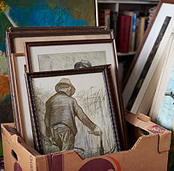 Paintings stacked in the study