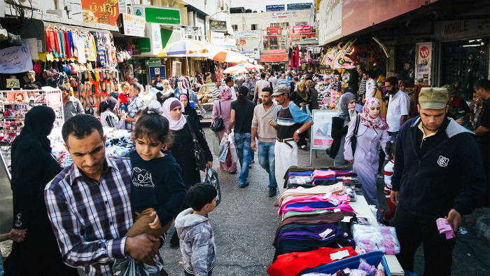 Palestinians shopping through the streets of West Bank city of Ramallah on October 14, 2013, in preparation for the Muslim holiday of Eid al-Adha