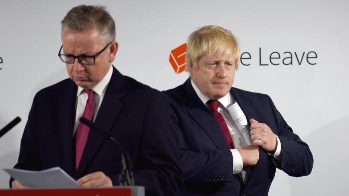 Michael Gove, U.K. justice secretary, left, prepares to speak as Boris Johnson, former mayor of London, listens during a news conference at the Vote Leave headquarters following the results in the European Union (EU) referendum in London, U.K., on Friday, June 24, 2016. Johnson, the bookmakers’ favorite to succeed David Cameron as prime minister after Britain voted to leave the European Union, will have to complete a transition from “court jester” to statesman to step into the role. His first task is to articulate what a Brexit will actually mean. Photographer: Mary Turner/Pool via Bloomberg