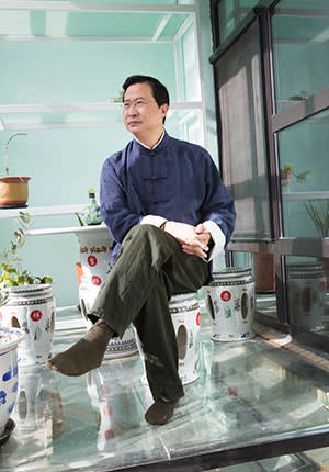 Rao Yi in the sunroom of his home in Beijing