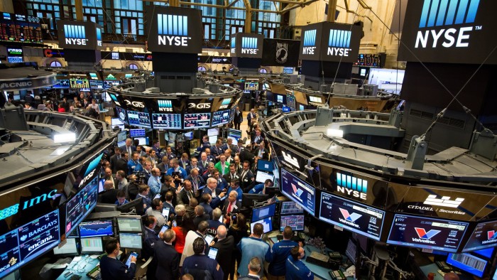 Traders work on the floor of the New York Stock Exchange (NYSE) in New York, U.S., on Friday, Sept. 23, 2016. U.S. stocks slipped as investors considered whether shares have climbed too far too fast, after a rally spurred by central-bank optimism put the S&amp;P 500 Index on track for its best weekly advance in two months. Photographer: Michael Nagle/Bloomberg