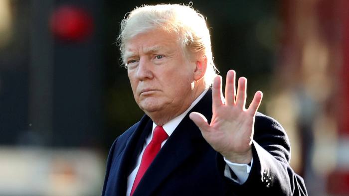 FILE PHOTO: U.S. President Donald Trump waves prior to departing on a trip to Wisconsin from the White House in Washington, U.S., October 24, 2018. REUTERS/Cathal McNaughton/File Photo