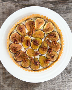 Figs cut in half and arranged in a circle on top of the cheese mixture