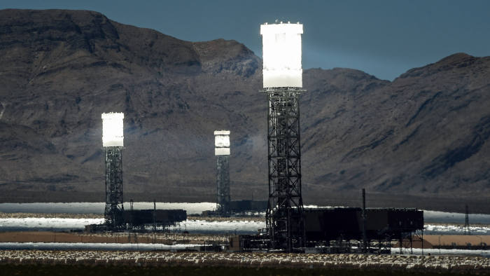 PRIMM, NV - JULY 23: The three towers at the Ivanpah Solar Electric Generating System are shown in operation on July 23, 2014 in the Mojave Desert in California near Primm, Nevada. The largest solar thermal power-tower system in the world, owned by NRG Energy, Google and BrightSource Energy, opened earlier this year in the Ivanpah Dry Lake and uses 347,000 computer-controlled mirrors to focus sunlight onto boilers on top of three 459-foot towers, where water is heated to produce steam to power turbines providing power to more than 140,000 California homes. (Photo by Ethan Miller/Getty Images)