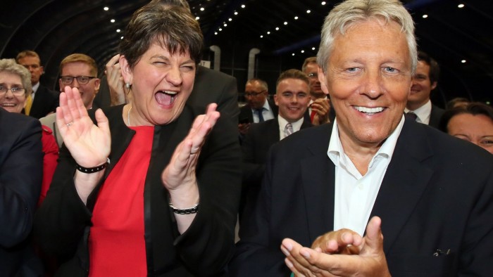 Democratic Unionist Party (DUP) leader Arlene Foster (L) celebrates with Former Democratic Unionist Party (DUP) Leader, Peter Robinson (R) at the counting centre in Belfast, Northern Ireland, early in the morning of June 9, 2017, hours after the polls closed in Britain's general election. Prime Minister Theresa May is poised to win Britain's snap election but lose her parliamentary majority, a shock exit poll suggested on June 8, in what would be a major blow for her leadership as Brexit talks loom. The Conservatives were set to win 314 seats, followed by Labour on 266, the Scottish National Party on 34 and the Liberal Democrats on 14, the poll for the BBC, Sky and ITV showed. / AFP PHOTO / Paul FAITHPAUL FAITH/AFP/Getty Images