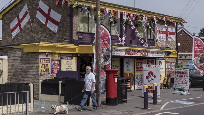 Flags of England and other nations competing in the UEFA European Championship decorate a convenience store in Canvey Island, England, June 10, 2016. The increasingly ugly, anti-immigrant tone to the campaign over a referendum on Britain's membership in the European Union has left many feeling that the boundaries of acceptable behavior are breaking down. (Andrew Testa/The New York Times) Credit: New York Times / Redux / eyevine For further information please contact eyevine tel: +44 (0) 20 8709 8709 e-mail: info@eyevine.com www.eyevine.com
