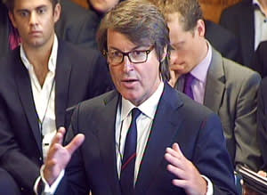 Buckles apologising to MPs for the 2012 Olympics 'shambles' when the company failed to supply enough security staff