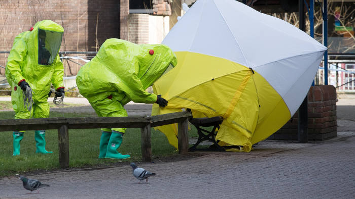 SALISBURY, ENGLAND - MARCH 07: Specialist officers in protective suits secure the police forensic tent that had been blown over by the wind and is covering the bench where Sergei Skripal was found critically with his daughter on March 4 and were taken to hospital sparking a major incident, in Salisbury on March 8, 2018 in Wiltshire, England. Sergei Skripal who was granted refuge in the UK following a 'spy swap' between the US and Russia in 2010 and his daughter remain critically ill after being exposed to an 'unknown substance'. (Photo by Matt Cardy/Getty Images)