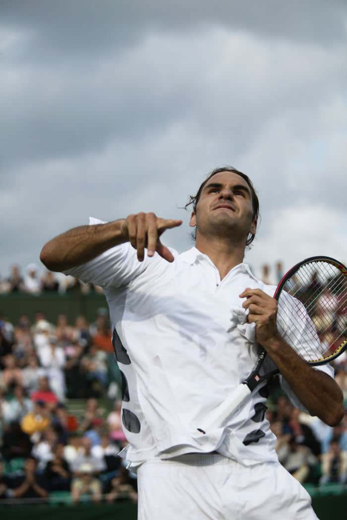 LONDON - JUNE 30: Roger Federer of Switzerland celebrates after his win over Feliciano Lopez of Spain during the fourth round of the Wimbledon Lawn Tennis Championships held on June 30, 2003 at the All England Lawn Tennis and Croquet Club, in London. (Photo by Clive Brunskill/Getty Images)