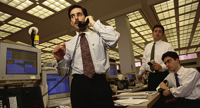 A Salomon Brothers stock trader talks on the telephone in the LDC trading area. | Location: Financial District, Lower Manhattan, New York, USA.  (Photo by mark peterson/Corbis via Getty Images)