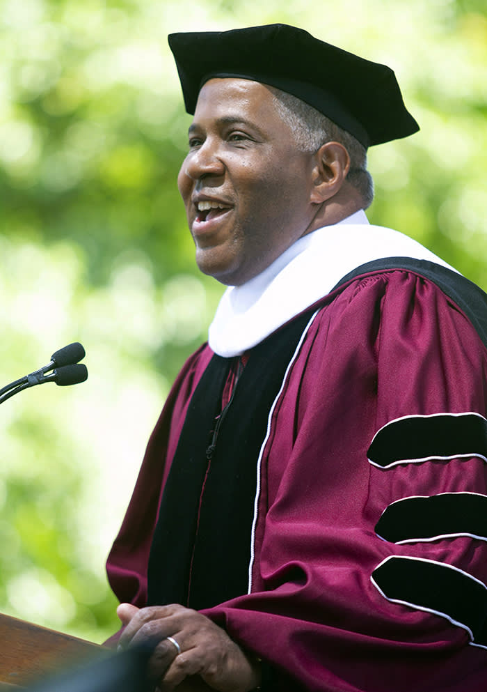 Billionaire technology investor and philanthropist Robert F. Smith announces he will provide grants to wipe out the student debt of the entire 2019 graduating class at Morehouse College in Atlanta, Sunday, May 19, 2019. (Steve Schaefer/Atlanta Journal-Constitution via AP)