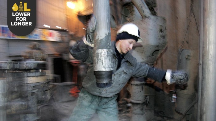 An oil worker in the Priobskoye field operated by Yuganskneftegaz, a unit of Rosneft